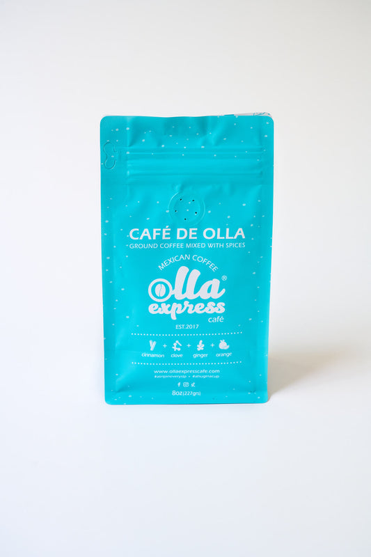 Light blue coffee bag with 'Café de Olla' branding on a white background