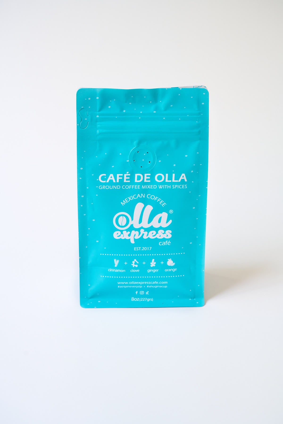 Light blue coffee bag with 'Café de Olla' branding on a white background
